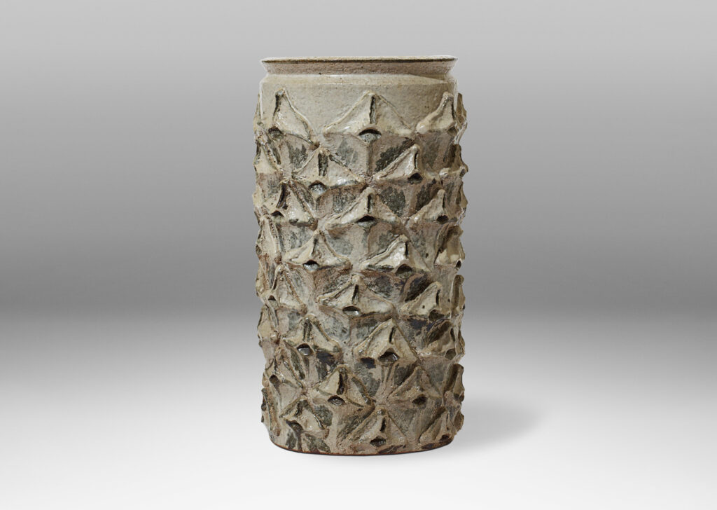 Gallery BAC cylindrical vase having a relief pattern of quatrefoil elements