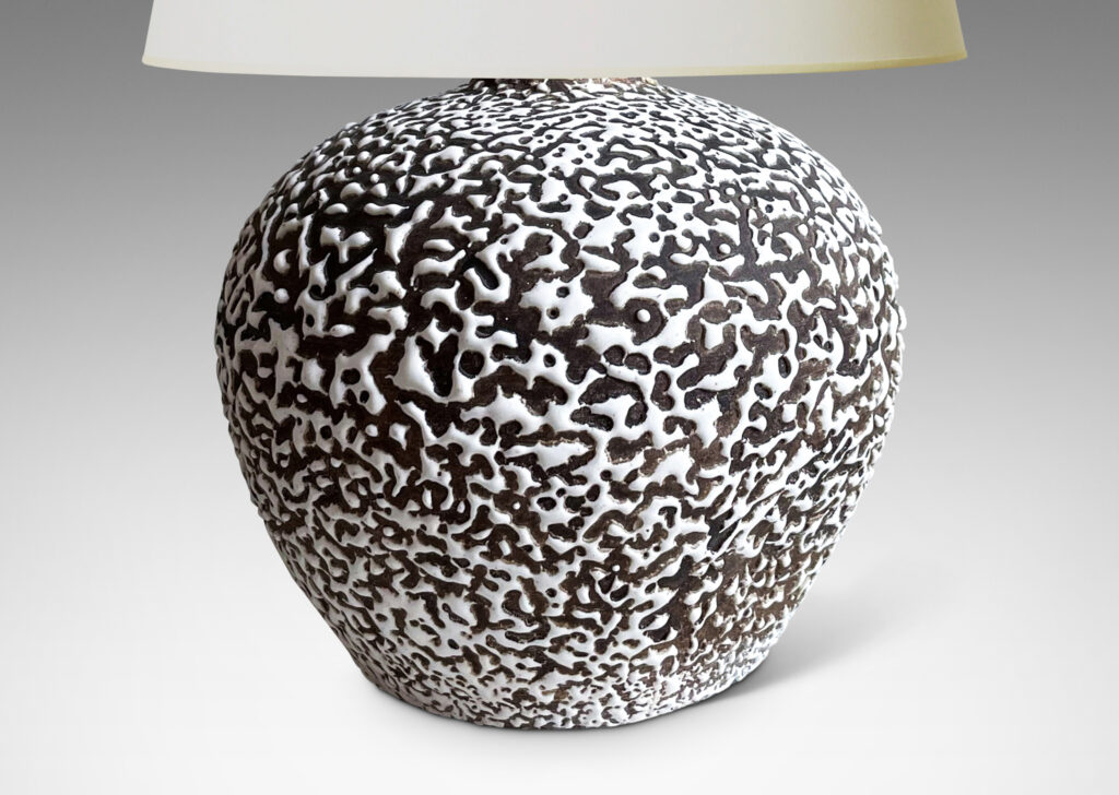 Gallery BAC angled and tapred globe forms in “crispé” beaded white over matte brown glazing