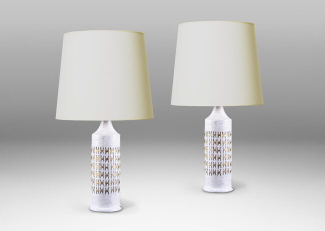 Gallery BAC columnar forms with carved design in white and gold