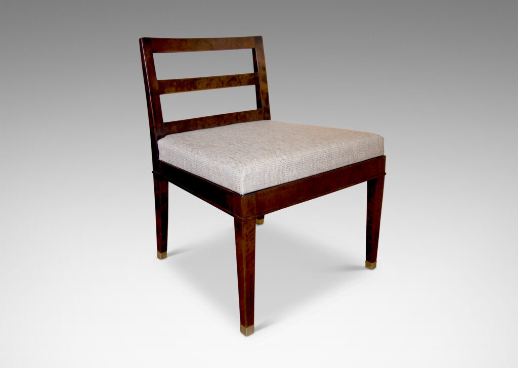 Gallery BAC slipper chairs crafted in stained Baltic birch