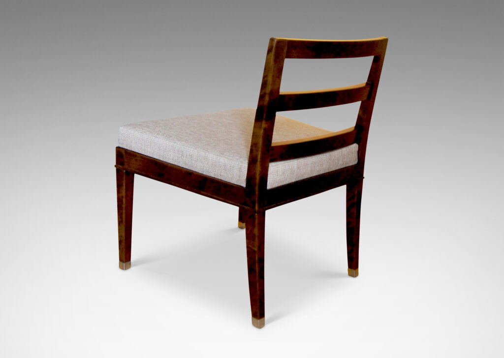 Gallery BAC slipper chairs crafted in stained Baltic birch