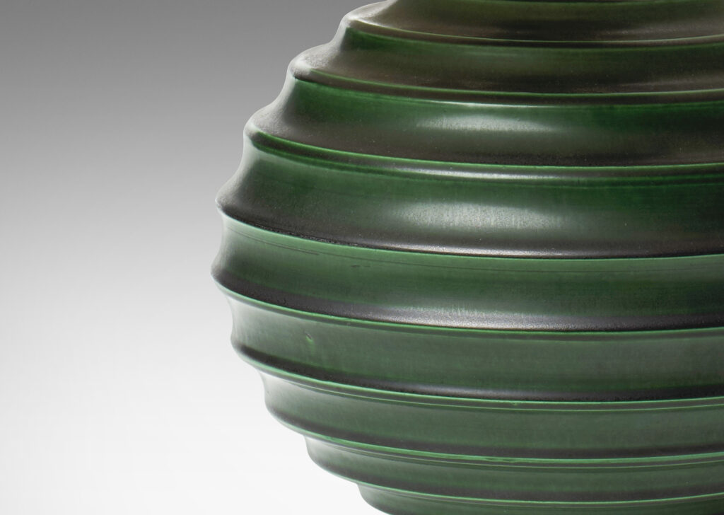 Gallery BAC amp with deep and sculptural horizontal fluting in stoneware with deep green glaze