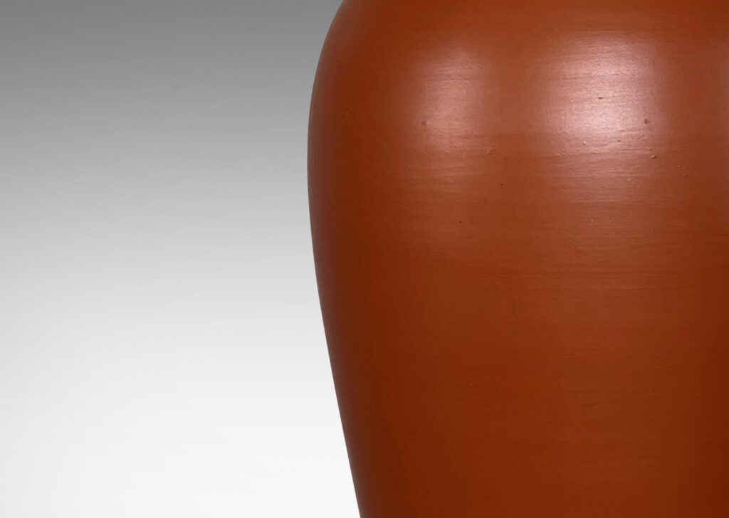 Gallery BAC apering forms in earthenware with a rich egg-shell finish burnt sienna red-brown glaze