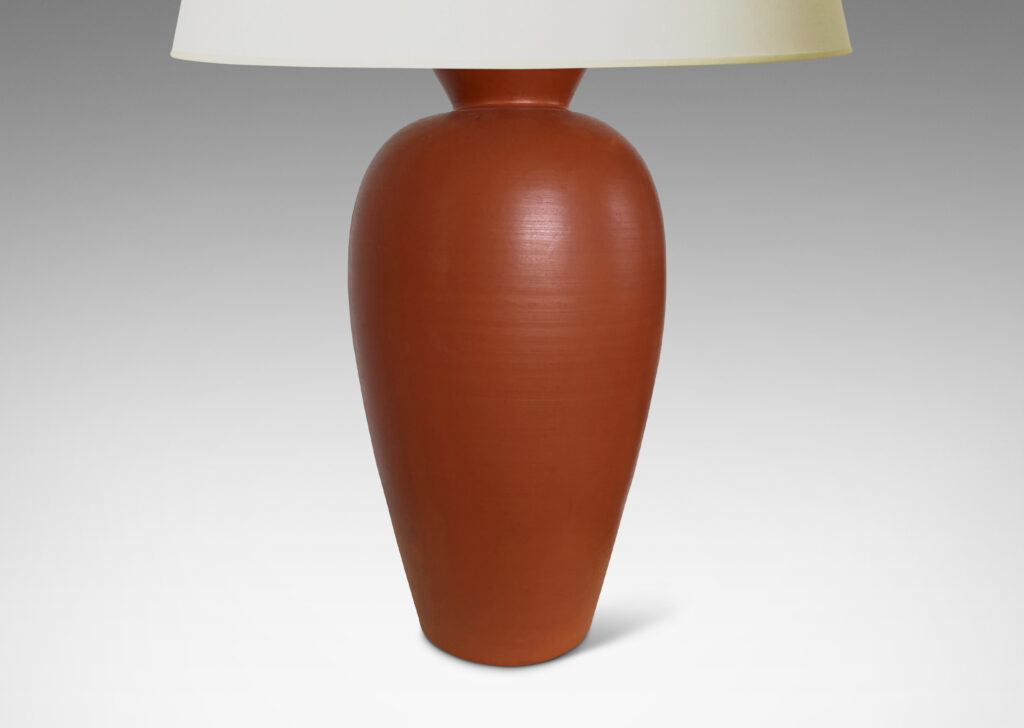 Gallery BAC apering forms in earthenware with a rich egg-shell finish burnt sienna red-brown glaze