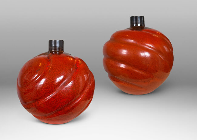 Gallery BAC tapering globe forms with concentric lobes in persimmon orange with luster charcoal glaze