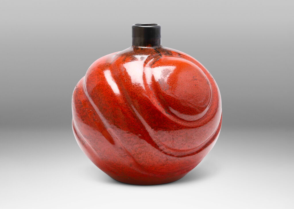 Gallery BAC tapering globe forms with concentric lobes in persimmon orange with luster charcoal glaze