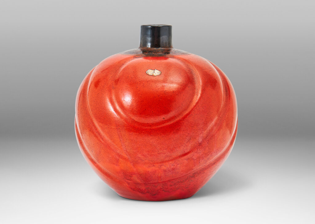 Gallery BAC tapering globe forms with concentric lobes in persimmon orange with luster charcoal glaze