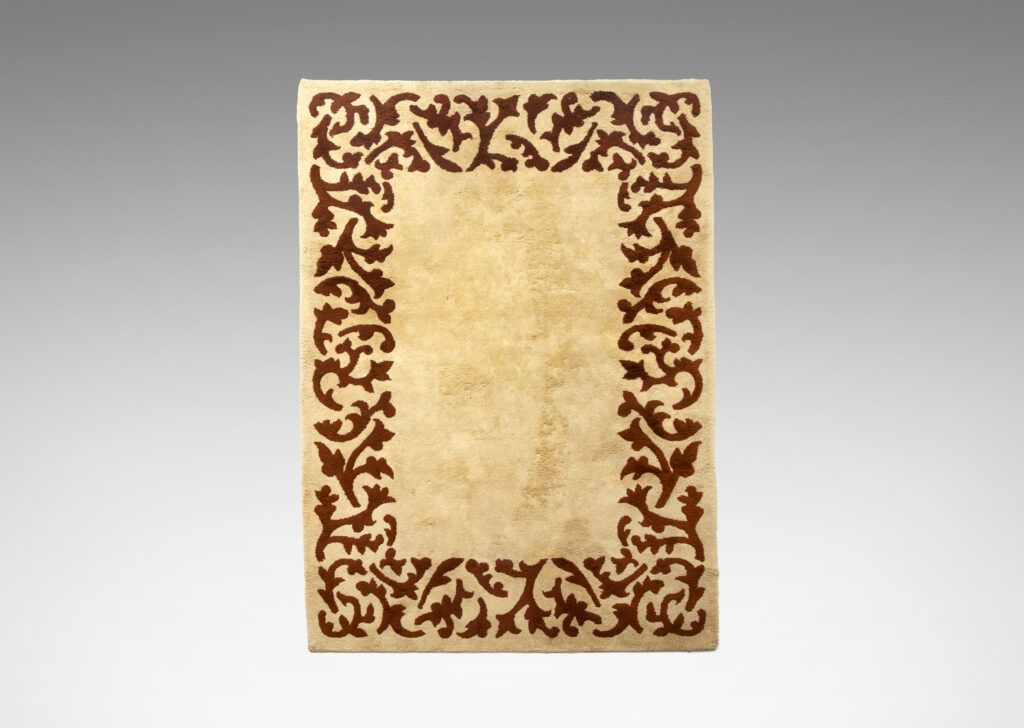 Gallery BAC carpet in two shades of brown, with sculpted foliate border