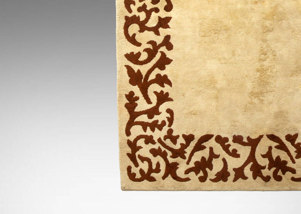 Gallery BAC carpet in two shades of brown, with sculpted foliate border