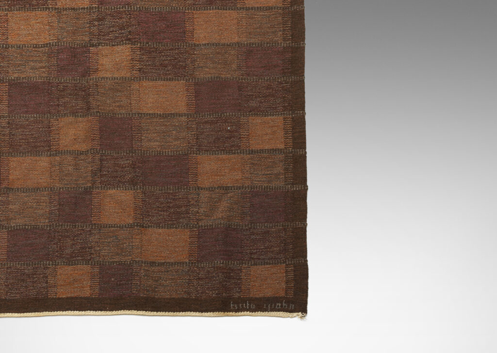 Gallery BAC Hand-woven wool flat-weave carpet with checker pattern in in marled purple, brown, and burnt orange yarns by Brita Grahn