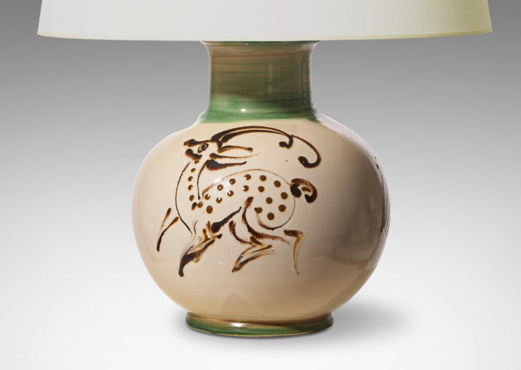 Gallery BAC globe form with neck and reveal footing, in earthenware glazed in ivory with quill painted deer figure in brown