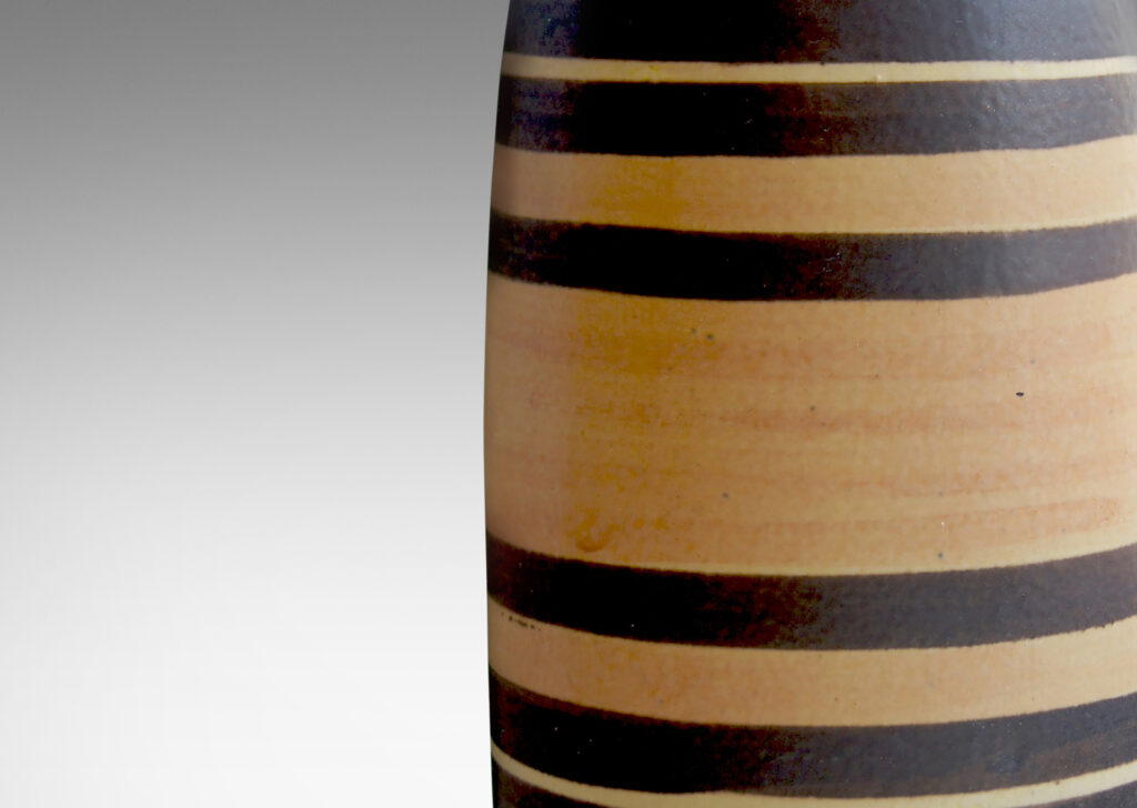 Gallery BAC stoneware glazed in brown with pumpkin orange stripes