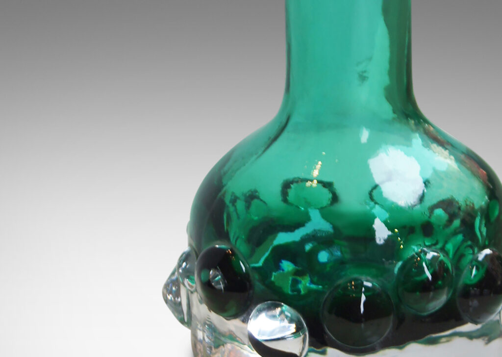 Gallery BAC bottle forms in clear glass with emerald green inside tint and applied bubble relief