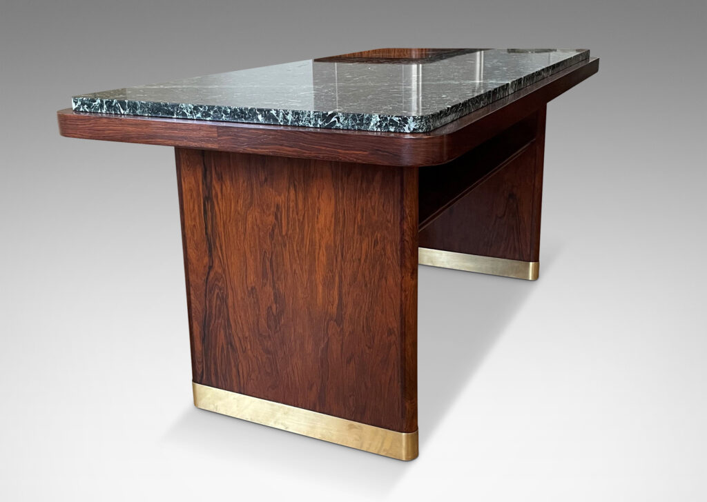 Gallery BAC rectangular top with rounded corners and inset marble surface on two rounded plank pier legs with a connecting shelf in palisander with original marble top, and brass sabots