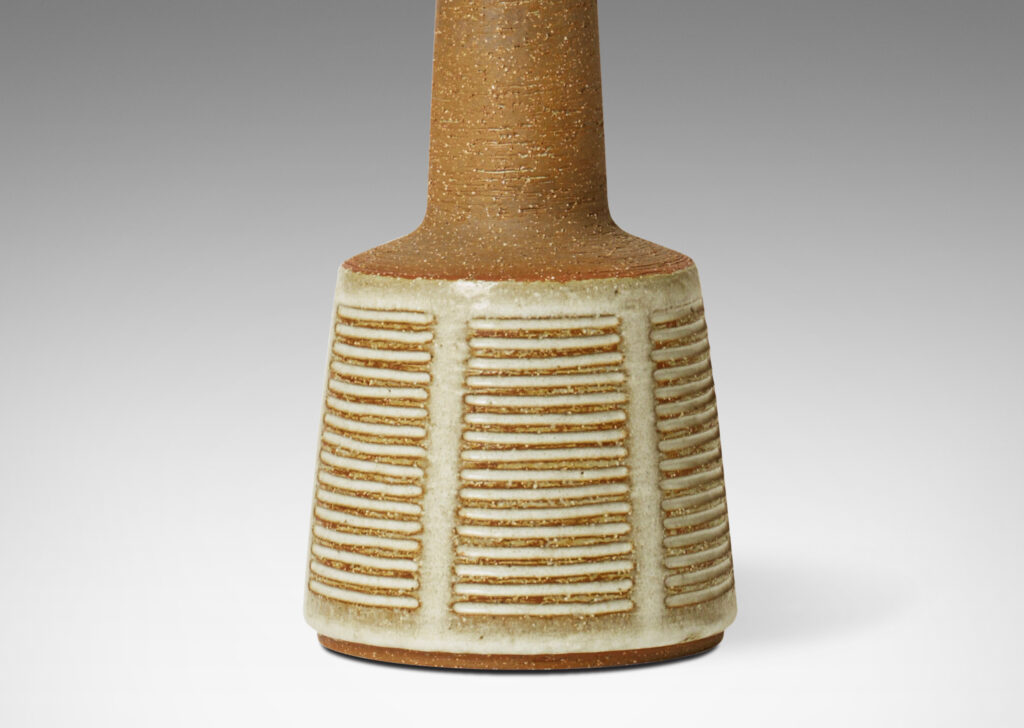 Gallery BAC long tapered neck on a flared drum base, in stoneware in a warm brown tone, partially glazed in a pale gray