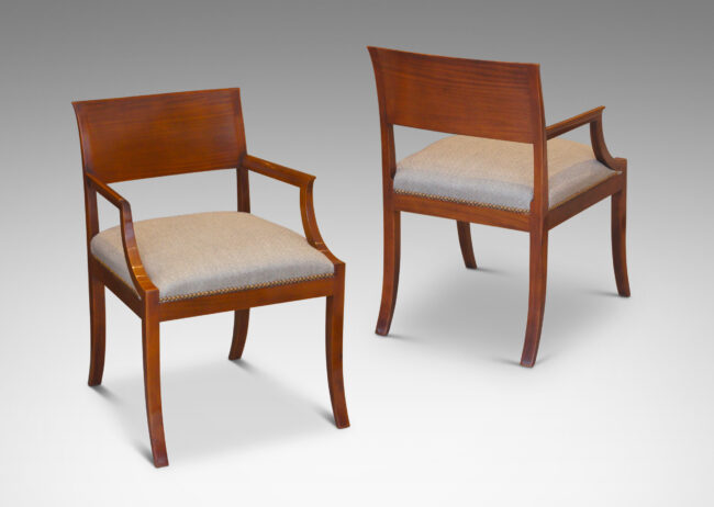 Gallery BAC klismos-style back rail, sabered legs, and arms having cavetto fronts, in Cuban mahogany