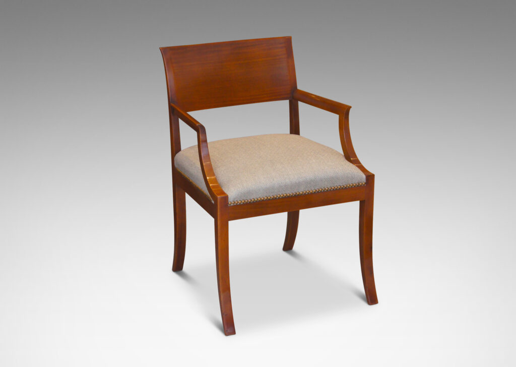 Gallery BAC klismos-style back rail, sabered legs, and arms having cavetto fronts, in Cuban mahogany