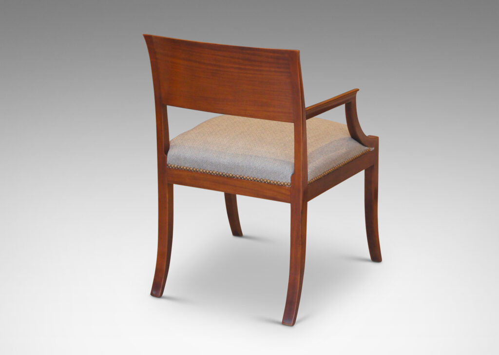 Gallery BAC klismos-style back rail, sabered legs, and arms having cavetto fronts, in Cuban mahogany