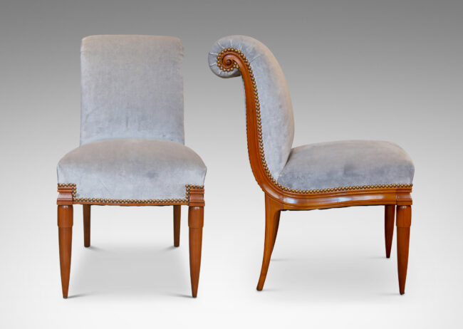 Gallery BAC solid cuts of cherry with carved detailing, having two round tapering front legs with tassel shaped tops and sabered back legs and S-form frame with rolled back