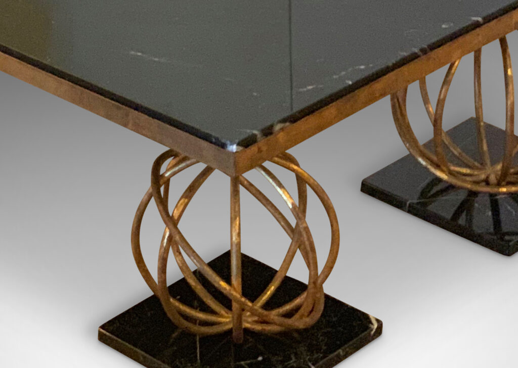 Gallery BAC coffee table by Jean Royère, having a rectangular black marble top supported on four “Sphère” motif legs