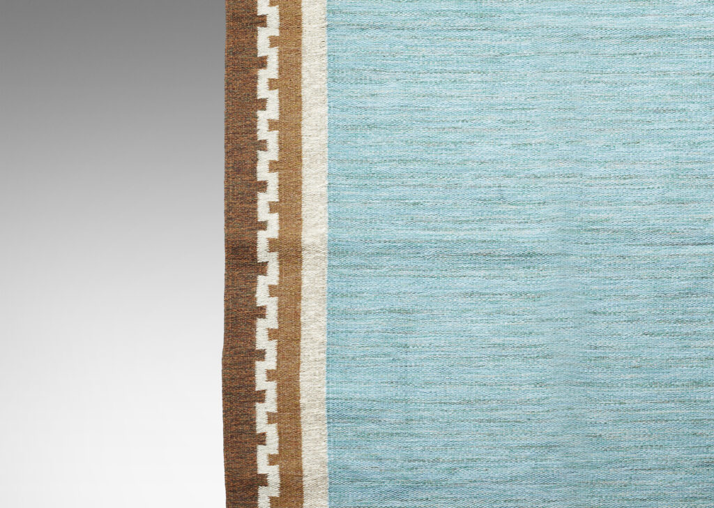 Gallery BAC triking marled cerulean field framed in a border featuring a Greek meander pattern in ivory against two shades of brown