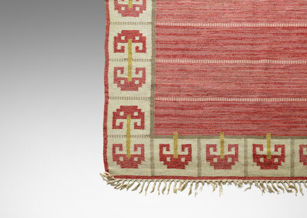 Gallery BAC field of broad stripes of modulating red hues in marled yarns with border of double and single umbel shapes in red, gold and ivory