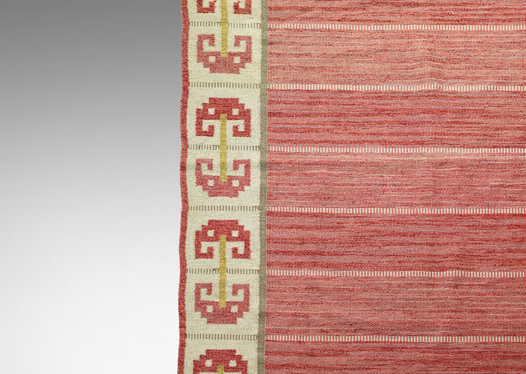 Gallery BAC field of broad stripes of modulating red hues in marled yarns with border of double and single umbel shapes in red, gold and ivory