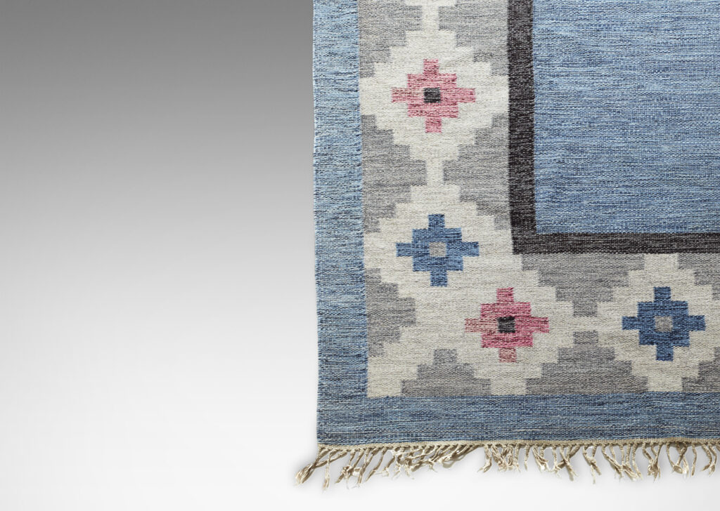 Gallery BAC marled blue yarn and border of stepped diamonds in rose, blue, ivory and grays