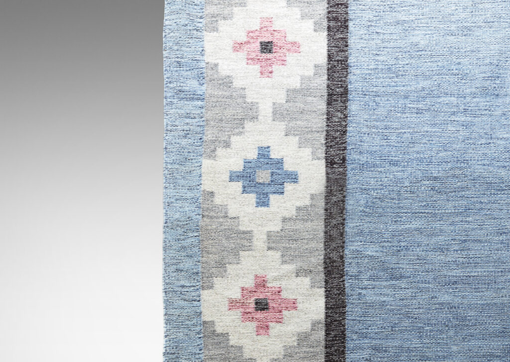 Gallery BAC marled blue yarn and border of stepped diamonds in rose, blue, ivory and grays