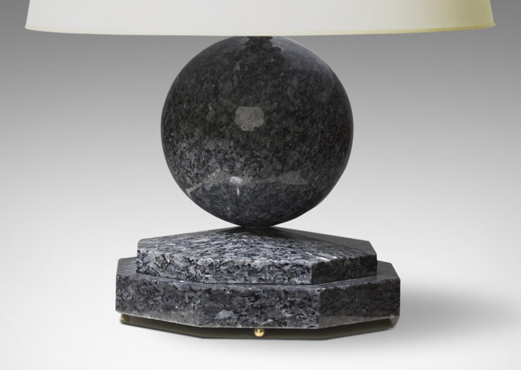 Gallery BAC sphere on a stepped octagonal plinth, solid polished granite