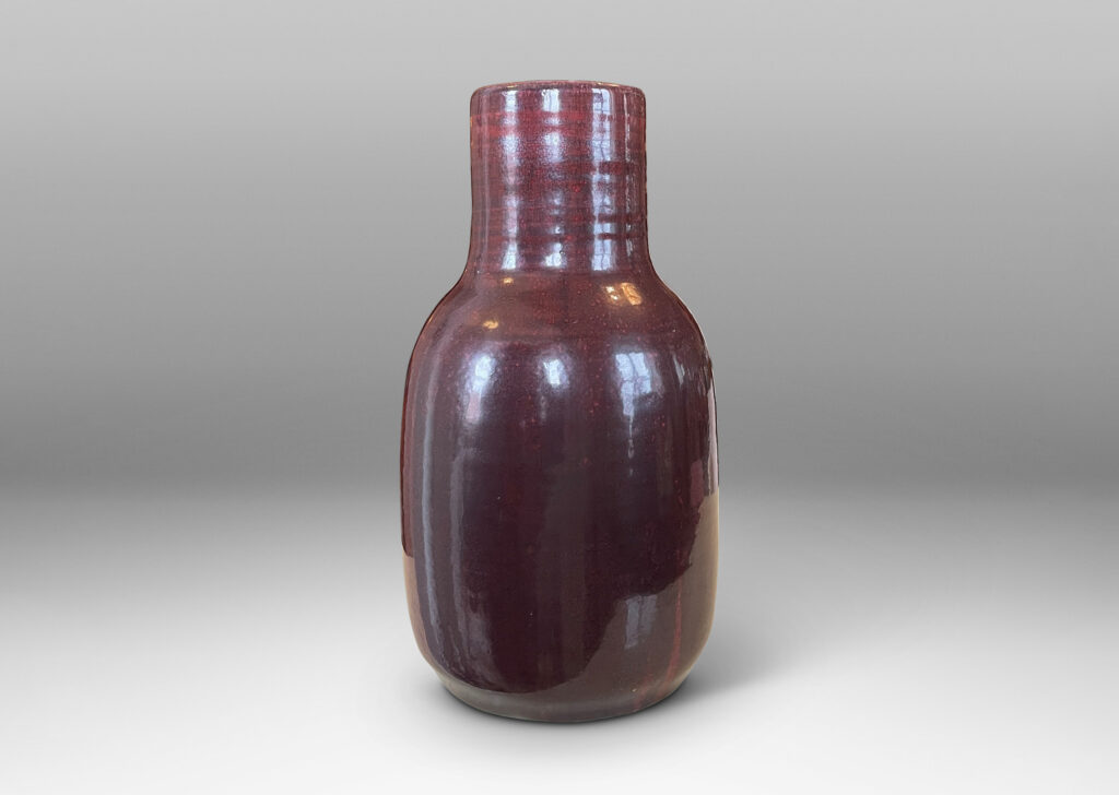 Gallery BAC straight-sided ovoid form and wide neck with retained turning ridges and a magnificent rich oxblood burgundy glaze