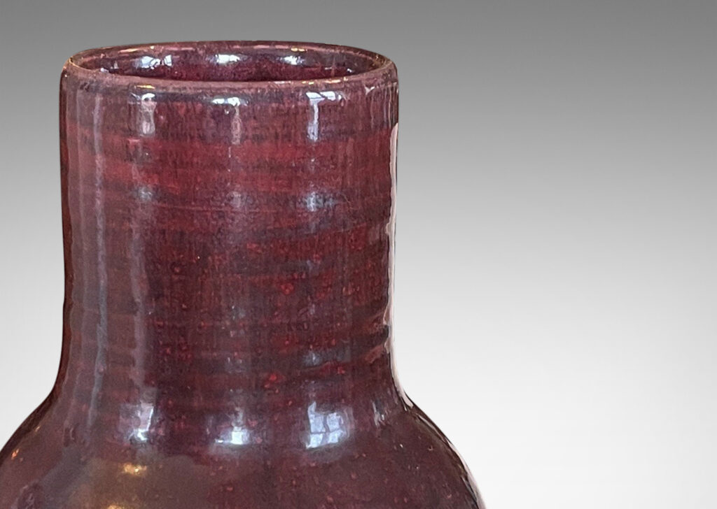 Gallery BAC straight-sided ovoid form and wide neck with retained turning ridges and a magnificent rich oxblood burgundy glaze