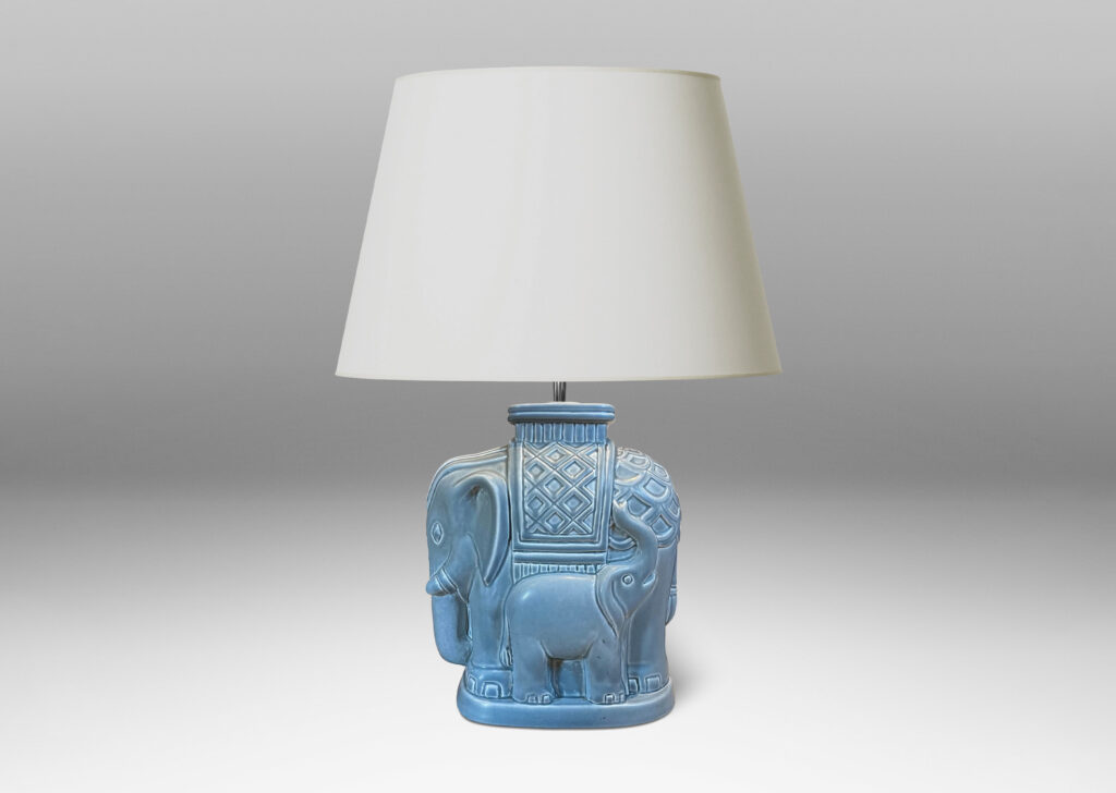 Gallery BAC elephant with its calf on one side in a pale blue-gray