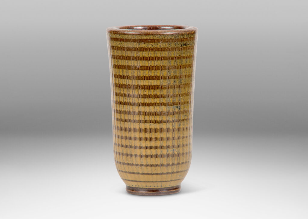 Gallery BAC vase with reeded tapering form on a disk plinth glazed in brown and ochre by Arthur Andersson