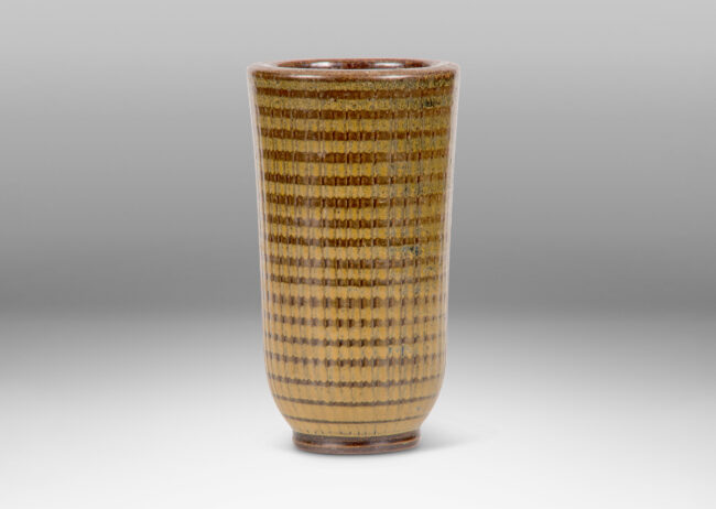 Gallery BAC vase with reeded tapering form on a disk plinth glazed in brown and ochre by Arthur Andersson