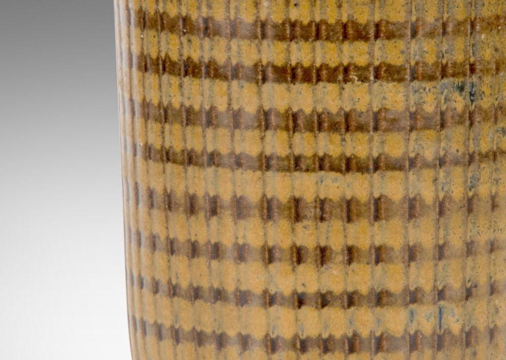 Gallery BAC vase with reeded tapering form on a disk plinth glazed in brown and ochre by Arthur Andersson