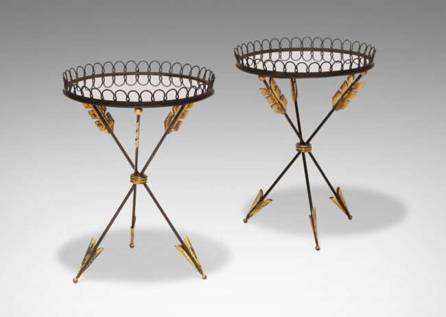 Gallery BAC tripod base in the form of three arrows joined at the center, supporting a round mirrored glass top edged in an airy looping border