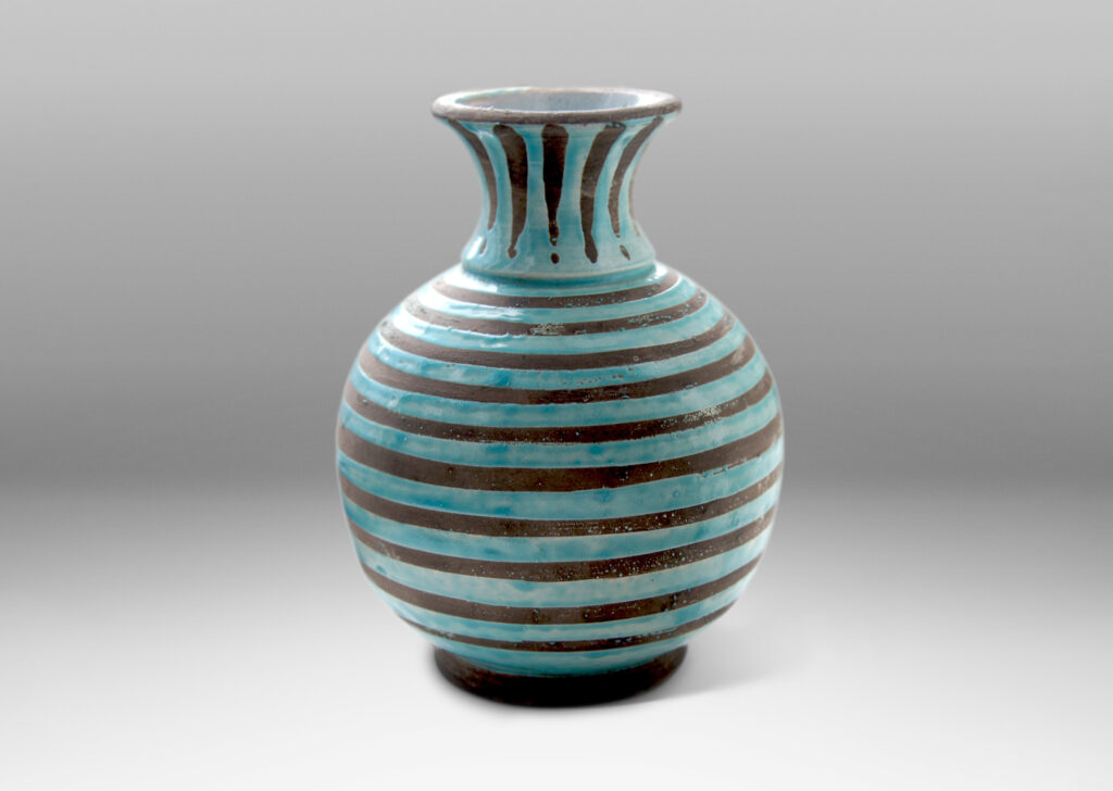 Gallery BAC spherical body with outstretched neck/mouth, perched on a low reveal foot, crafted in gray earthenware partially glazed in dimensionally thick pale aqua stripes