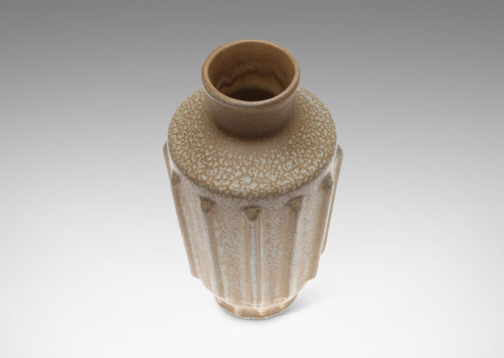 Gallery BAC Brancusi-like assemblage of round volumes of alternate tapers, with beveled vertical ribs encircling body, in stoneware glazed in a frothy ivory / beige with eggshell finish