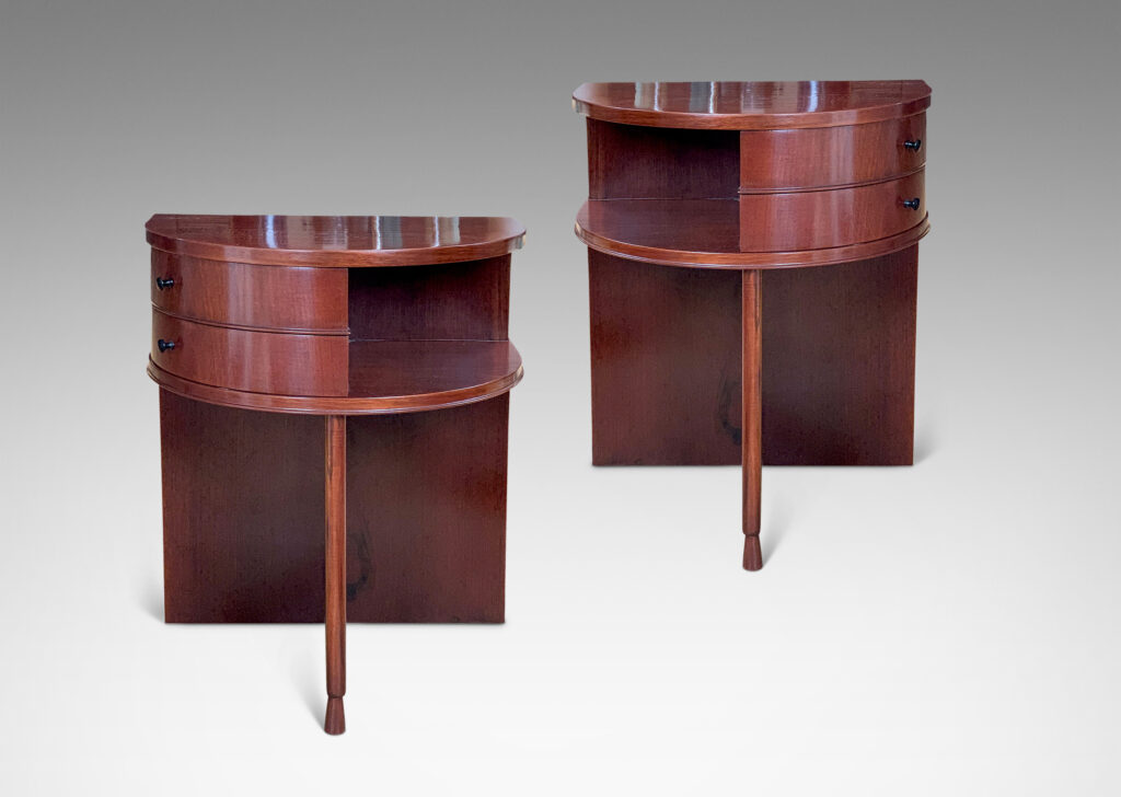 Gallery BAC nightstands with demi-lune curved tops and fronts, each with two side-swinging drawers and a shelf om perpendicular pier legs with chamfered base