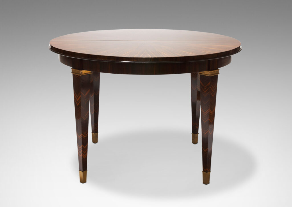 Gallery BAC table in macassar ebony, featuring sunburst effect top and chevron pattern on legs with brass sabots by Dominique