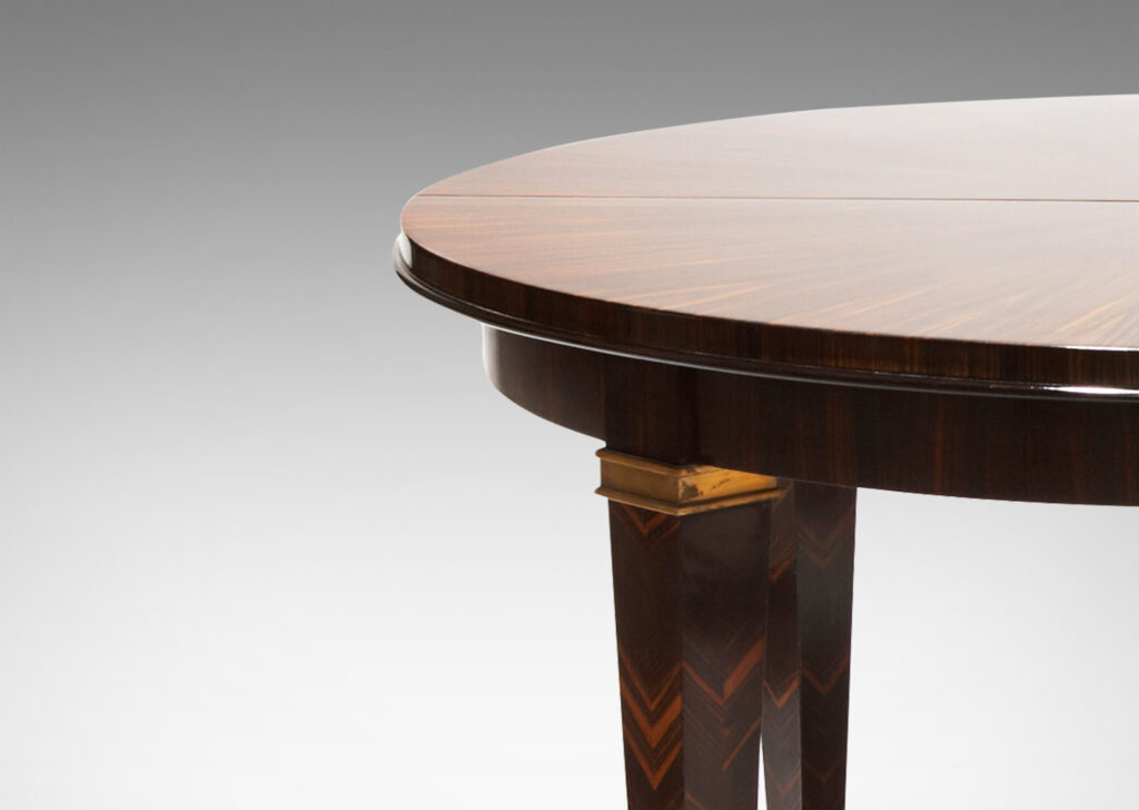 Gallery BAC table in macassar ebony, featuring sunburst effect top and chevron pattern on legs with brass sabots by Dominique