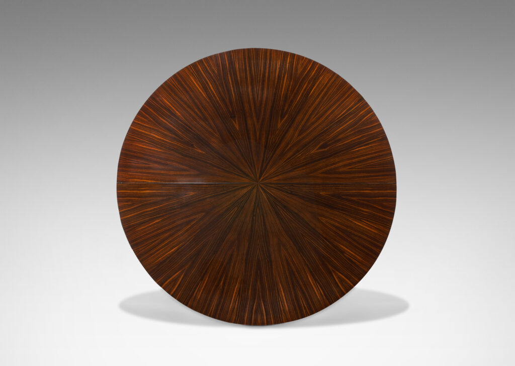 Gallery BAC table in macassar ebony, featuring sunburst effect top and chevron pattern on legs with brass sabots by Dominique