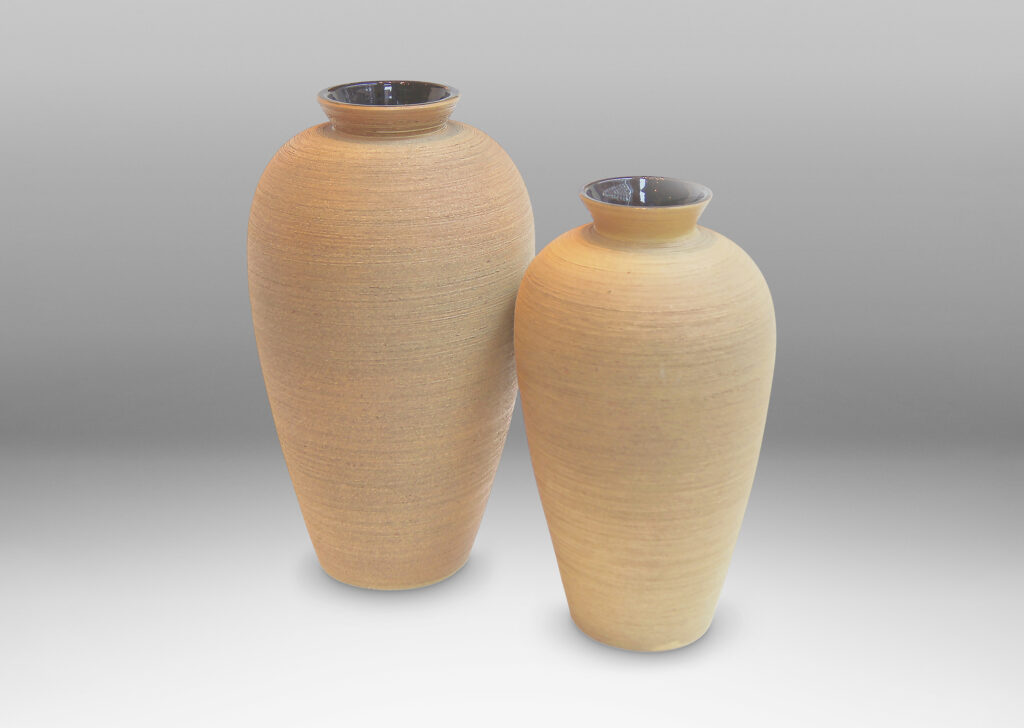 Gallery BAC slightly different size variant of the same model, featuring elegantly modeled tapering forms finished with a beautifully executed raked texture and matte ochre glaze on the outside