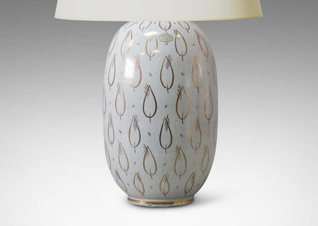 Gallery BAC ovoid form with white craquel finish and gilded leaf motifs in glazed earthenware