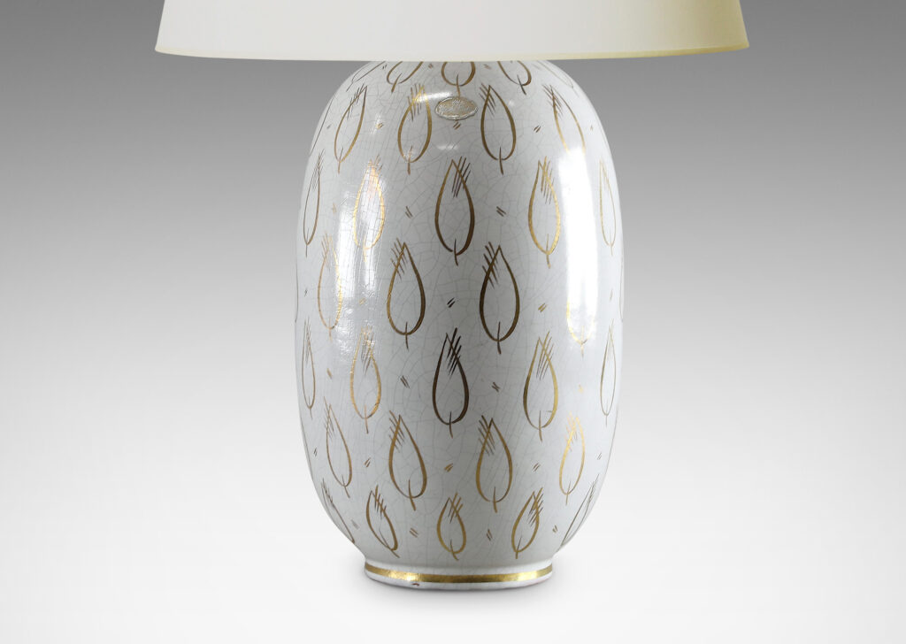 Gallery BAC ovoid form with white craquel finish and gilded leaf motifs in glazed earthenware