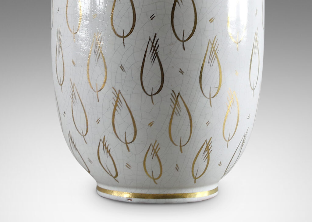 Gallery BAC ovoid form with white craquel finish and gilded leaf motifs in glazed earthenware