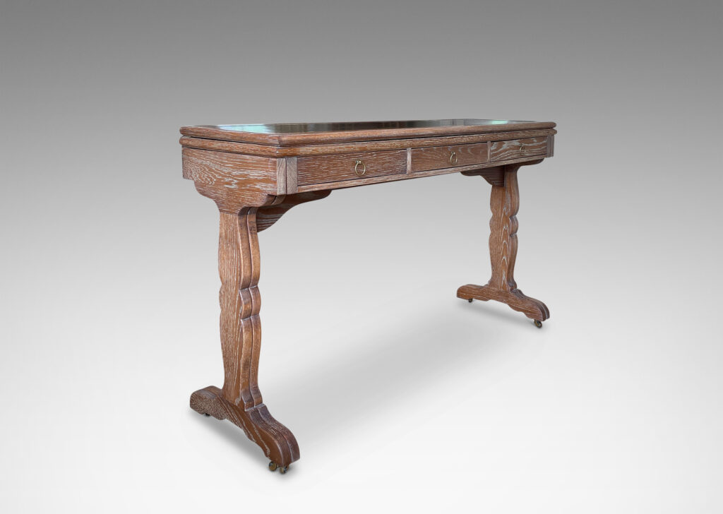 Gallery BAC xpanding console/desk design by Jean-Michel Frank, having a sinuously modeled Regency-inspired silhouette, two drawers, and the ability to double in size or shrink in half due to the ingeniously folding legs