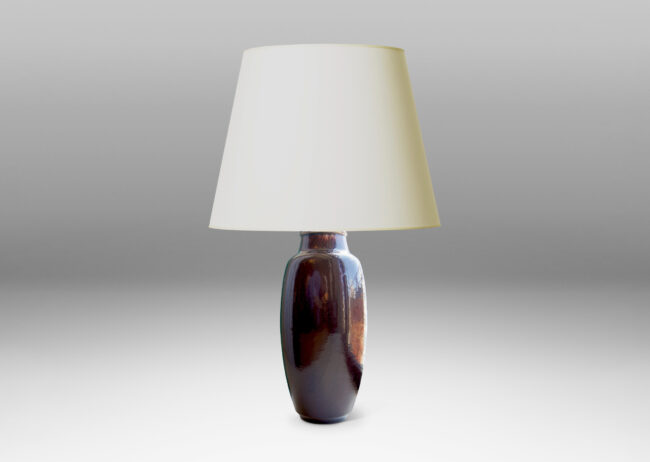 Gallery BAC apering oval form with arced neck in stoneware with a rich deep oxblood glaze