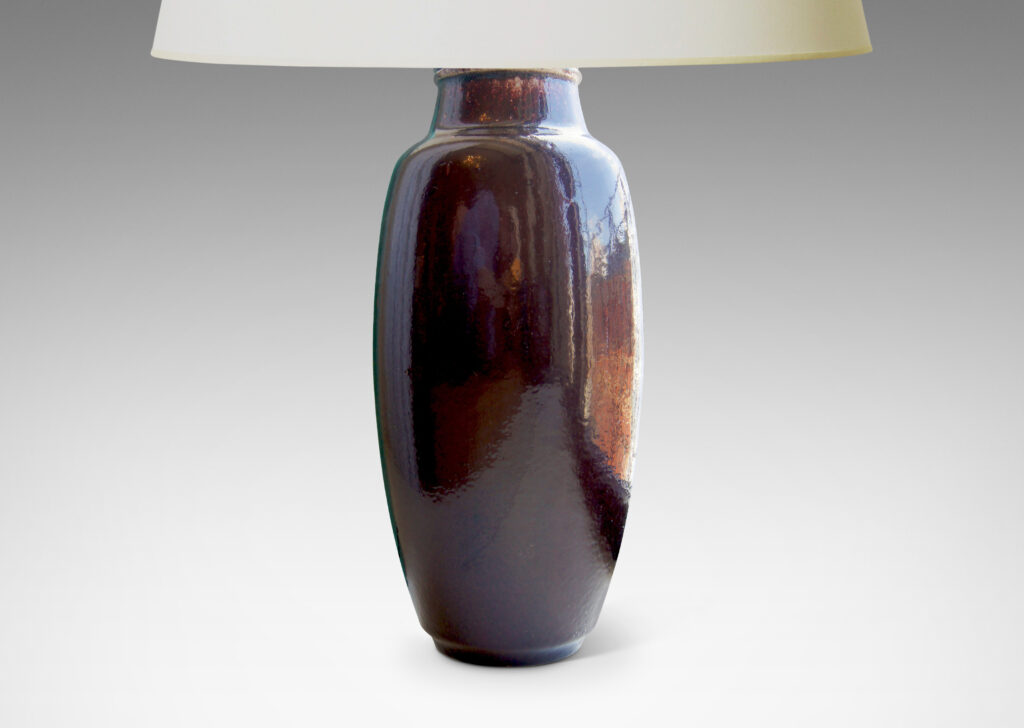 Gallery BAC apering oval form with arced neck in stoneware with a rich deep oxblood glaze